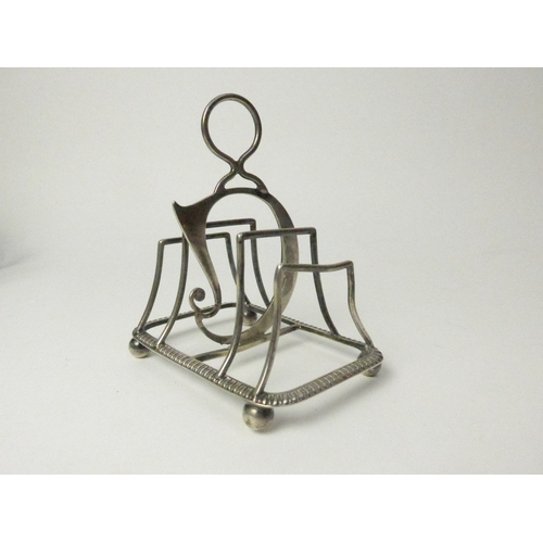 7133 - A William Hutton & Sons Ltd unusual silver toast rack with possible repair, 8cm long, London 1898, 5... 