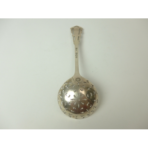 7022 - A Josiah Williams & Co silver sifting spoon with pierced terminal, 17cm long, London 1894, 40g