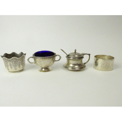 7137 - A silver mustard, salt, napkin ring and small bowl, various makers and dates (4), blue liners are ch... 