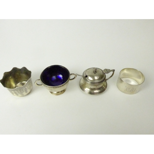 7137 - A silver mustard, salt, napkin ring and small bowl, various makers and dates (4), blue liners are ch... 