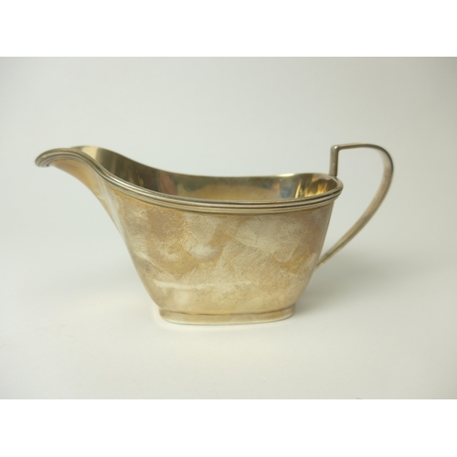 7138 - A Barkers Brothers silver milk jug with reeded handle and edge, 14cm long, Birmingham 1959, 103g