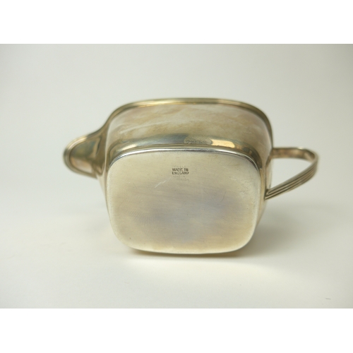 7138 - A Barkers Brothers silver milk jug with reeded handle and edge, 14cm long, Birmingham 1959, 103g