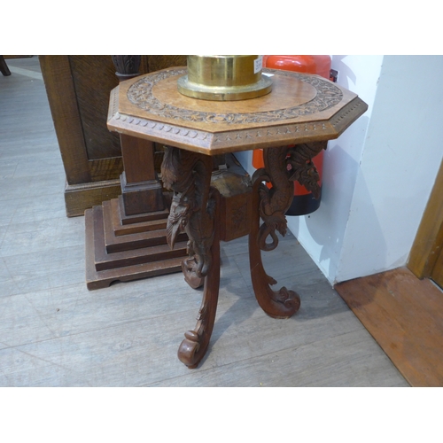 7514 - An Anglo Indian carved occasional table with mythical creative base