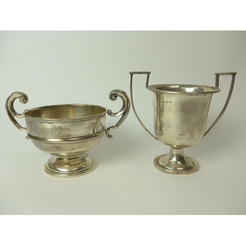 7150 - A silver twin handled trophy of bowl form and silver trophy of cup form engraved Betty Simpson (2), ... 