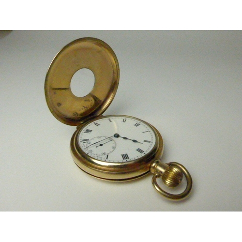 7036 - A gold plated half-hunter pocket watch with Dennison case