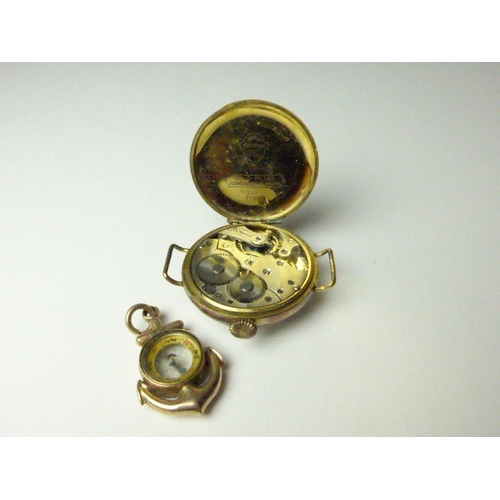 7039 - A wristwatch with gold filled Geneva watch case and a compass in the form of an anchor, 3.3cm diamet... 