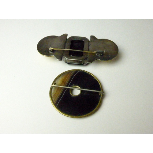 7035 - A Deco brooch (central stone scratched) together with a circular banded agate brooch, 8cm long and 4... 