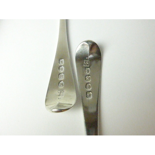 7119 - Eleven William Eley I & William Fearn dessert spoons with crest depicting a torso of a man holding a... 