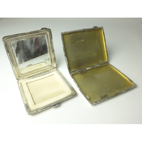 7113 - A silver monogrammed mirrored compact and cigarette case, both engine-turned, 7cm tall and 8.6cm tal... 