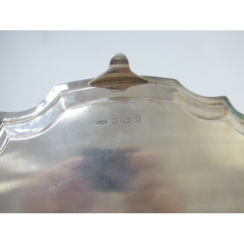 7001 - A Joseph Gloster Ltd silver tray with pie crust edge raised on four feet. Birmingham 1960. 35.5cm di... 