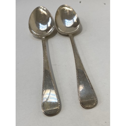 7098 - Two pairs of silver bright-cut serving spoons including John Lambe, London 1804, the other pair dati... 