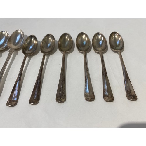 7165 - A set of six Robert and Belks Elizabeth II coronation coffee spoons and a set of six silver teaspoon... 