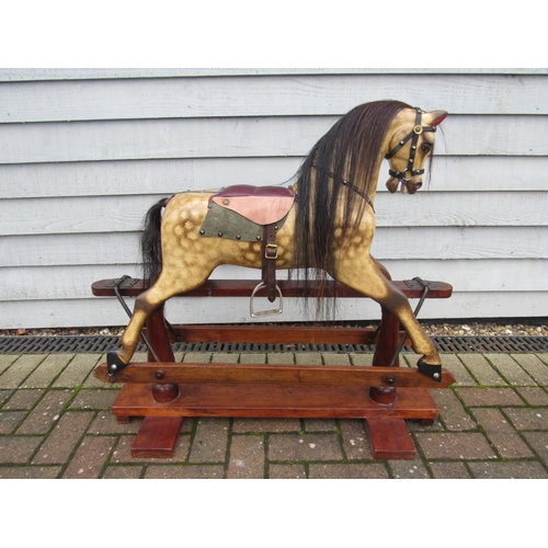 9200 - An early 20th Century crafted FH Ayres carved wood and painted gesso nursery size rocking horse, wit... 