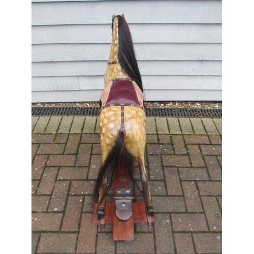 9200 - An early 20th Century crafted FH Ayres carved wood and painted gesso nursery size rocking horse, wit... 