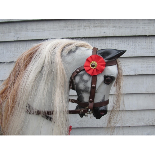 9201 - An early 20th Century crafted FH Ayres carved wood and painted gesso rocking horse, with fixed glass... 