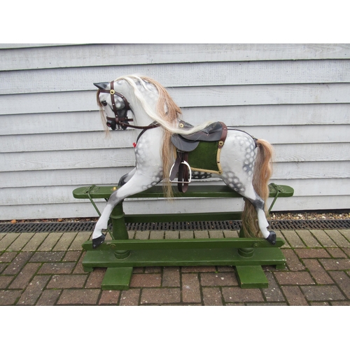 9201 - An early 20th Century crafted FH Ayres carved wood and painted gesso rocking horse, with fixed glass... 