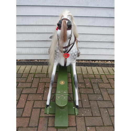 9201 - An early 20th Century crafted FH Ayres carved wood and painted gesso rocking horse, with fixed glass... 