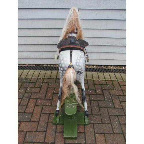 9201 - An early 20th Century crafted FH Ayres carved wood and painted gesso rocking horse, with fixed glass... 