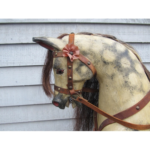 9206 - An early 20th century crafted rocking horse, possibly by JA Smith, with fixed glass eyes and flared ... 