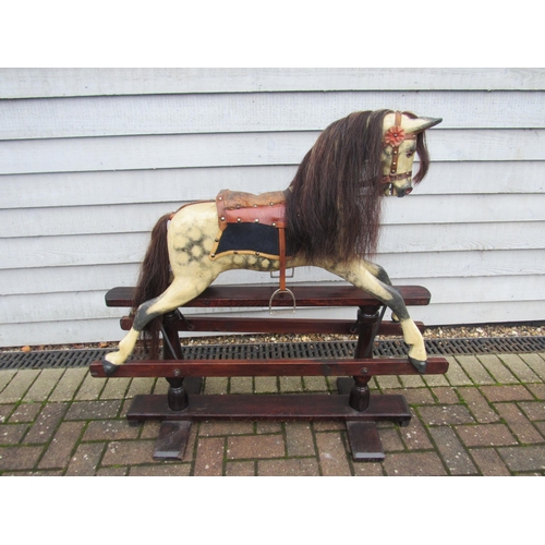 9206 - An early 20th century crafted rocking horse, possibly by JA Smith, with fixed glass eyes and flared ... 