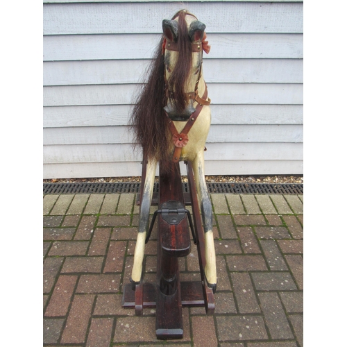 9206 - An early 20th century crafted rocking horse, possibly by JA Smith, with fixed glass eyes and flared ... 