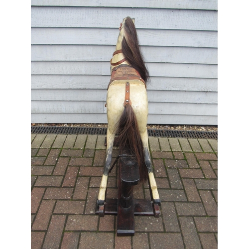 9206 - An early 20th century crafted rocking horse, possibly by JA Smith, with fixed glass eyes and flared ... 