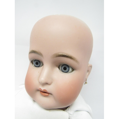 9238 - An early 20th Century Simon and Halbig for Kammer and Reinhart head girl doll with brown wig, striat... 