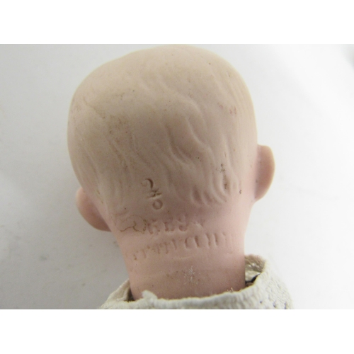 9321 - An early 20th Century Gebruder Heubach bisque head boy doll with Intaglio eyes, closed mouth, moulde... 