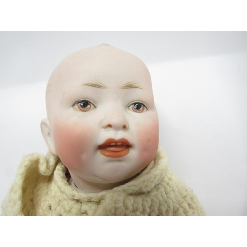 9321 - An early 20th Century Gebruder Heubach bisque head boy doll with Intaglio eyes, closed mouth, moulde... 