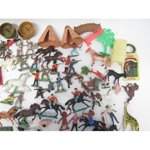 9163 - A collection of Britains and other plastic figures and accessories including farm animals, cowboys a... 