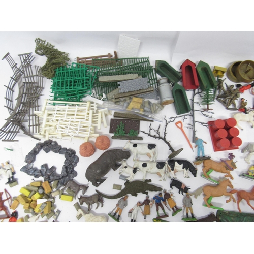 9163 - A collection of Britains and other plastic figures and accessories including farm animals, cowboys a... 