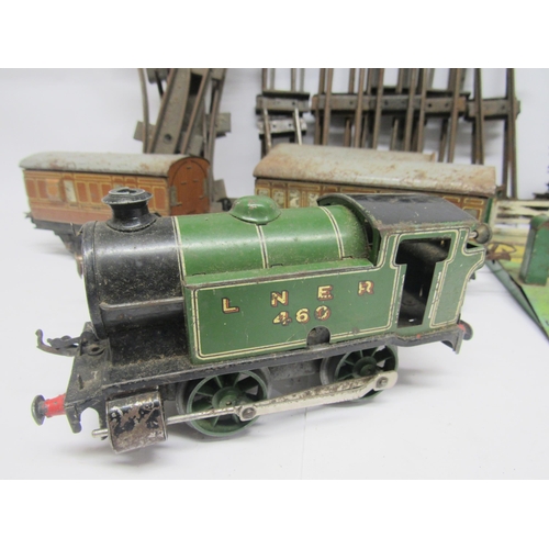 9558 - A playworn Hornby 0 gauge clockwork LNER 0-4-0 locomotive no.460, with three coaches, buffer stop, l... 