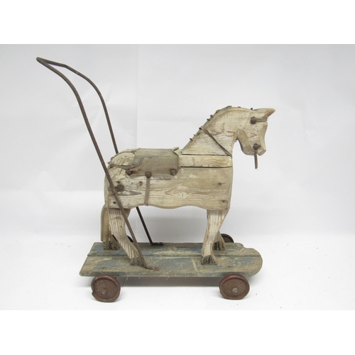 9203 - A late 19th / early 20th Century wooden pull-along horse for restoration, 50cm tall x 44cm long