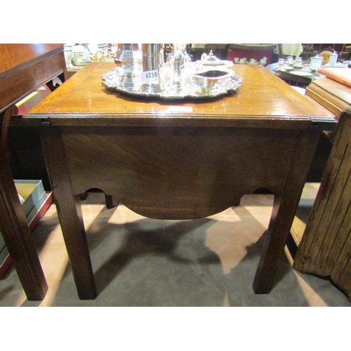 4267 - A 19th Century mahogany lamp table with hinged lid over a shaped apron and chamfered square legs, 48... 