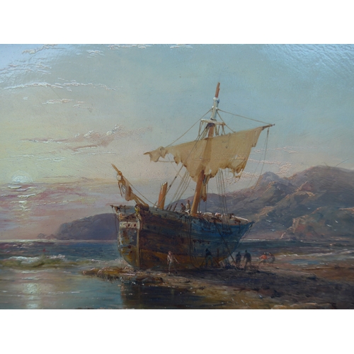 6014 - WILLIAM CLARKSON STANFIELD (1793-1867) An oil on panel, beached sailing vessel, sunset, 26.5cm x 36.... 