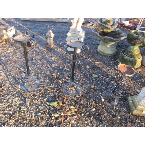 3425 - Three ornate metal pot stands