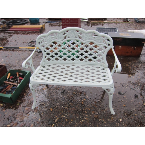 3426 - A cast alloy garden bench