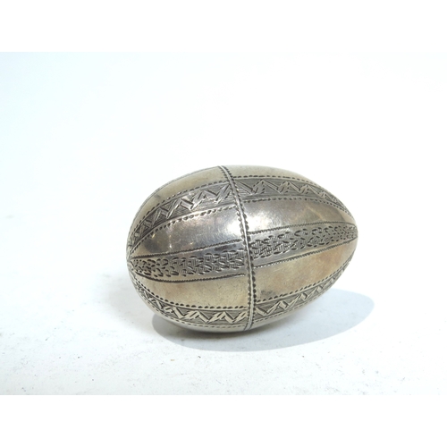 7052 - A 19th Century nutmeg grater of egg-form, maker's mark SM, 4.3cm long, 20g