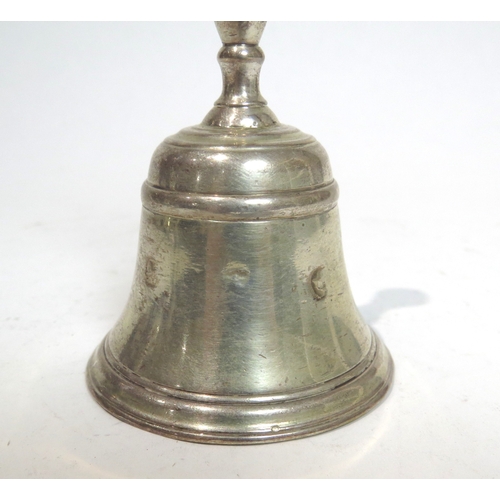 7075 - A Georgian silver bell with crown crest, marks undecipherable, 11cm tall.  120g