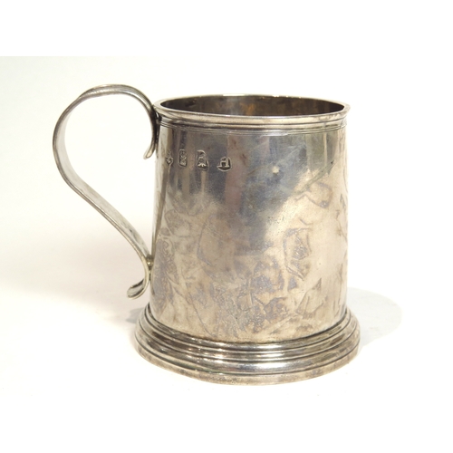 7073 - A George I John East silver tankard of small proportions, the base with punched R.C. initials, Londo... 