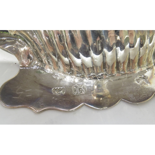 7058 - A pair of George II Samuel Herbert silver scallop-form butter dishes raised on conch shell feet, wit... 