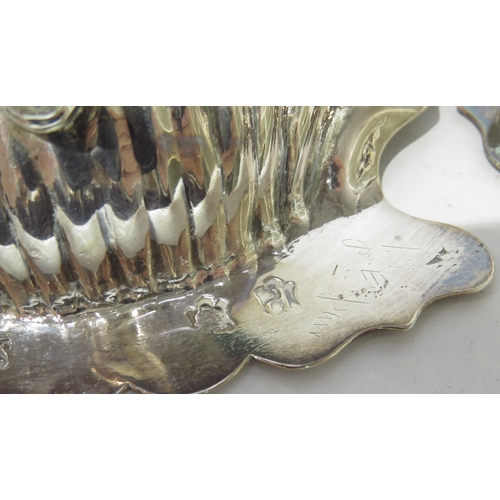 7058 - A pair of George II Samuel Herbert silver scallop-form butter dishes raised on conch shell feet, wit... 