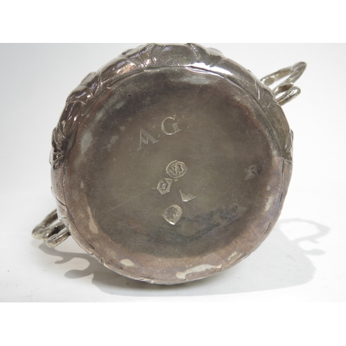 7066 - A Charles II silver porringer with Armorial crest and MB initialled monogram.  The base with maker's... 