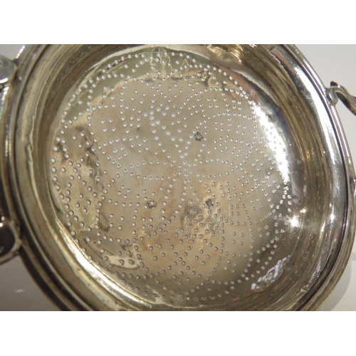 7054 - A George II silver lemon/orange strainer, marks rubbed but probably London 1752, 2.5cm tall x 11cm d... 