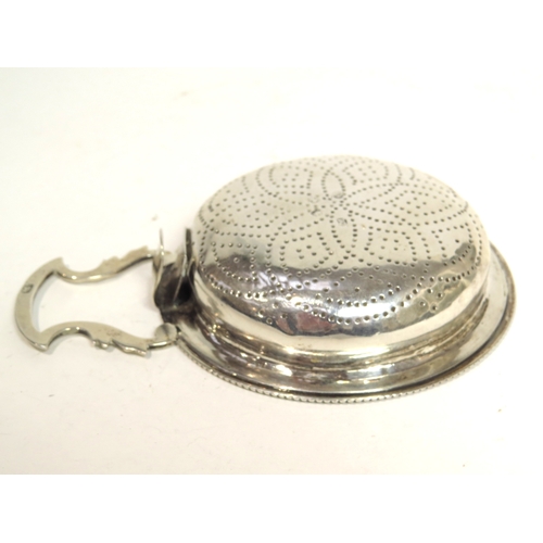 7056 - A George III silver lemon strainer, London 1775, maker's mark rubbed, 2cm tall x 9.5cm diameter excl... 