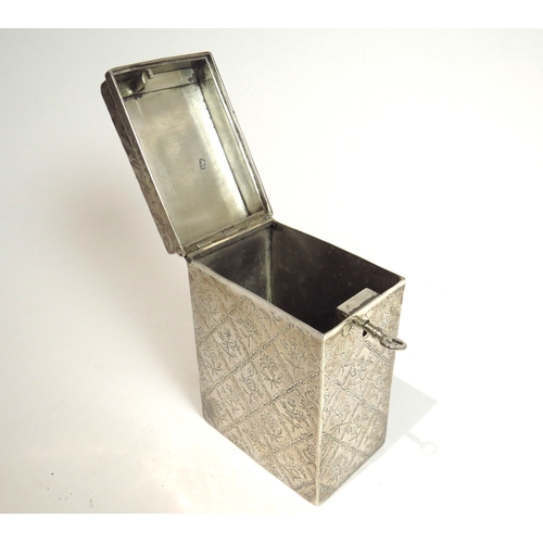 7064 - A George II Edward Wakelin silver lockable tea caddy of rectangular form with all-over lozenge patte... 