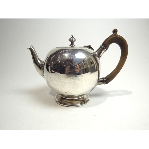 7072 - A Victorian Charles Stuart Harris silver bullet-form bachelor's teapot with treen handle, slight den... 