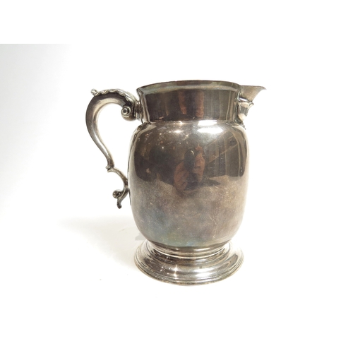 7070 - A George III William Grundy milk pitcher with acanthus leaf S-scroll handle with circular foot, Lond... 