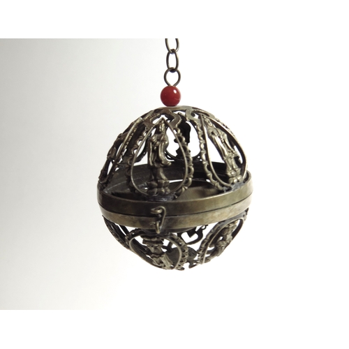 7059 - A white metal hanging globe temple incense burner with gimbal to interior, deity detail, character m... 