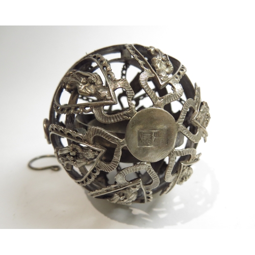 7059 - A white metal hanging globe temple incense burner with gimbal to interior, deity detail, character m... 